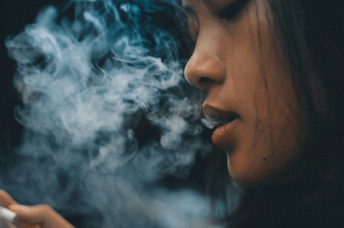 woman smoking weed - Cannabis club founding requirements