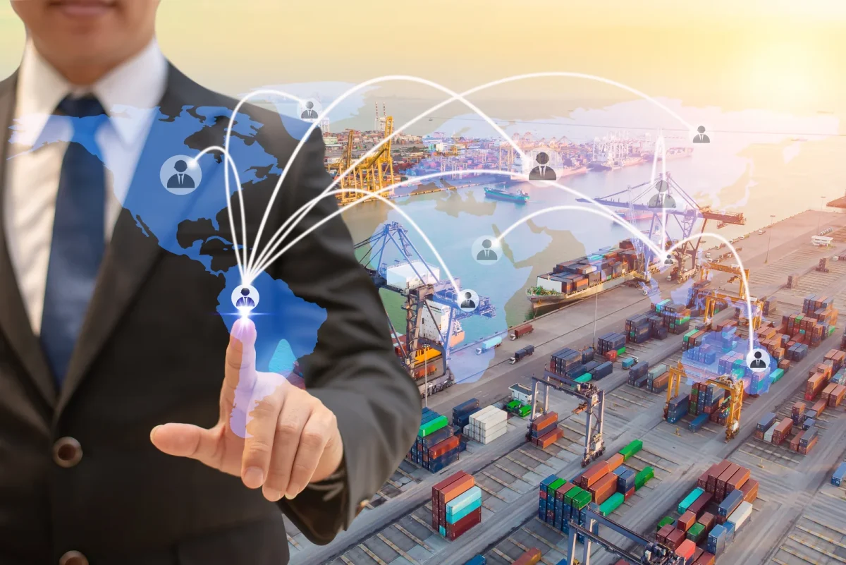 Business professional interacting with a virtual global network overlay, illustrating how Cannabis Supply Chain Software streamlines international cannabis logistics.
