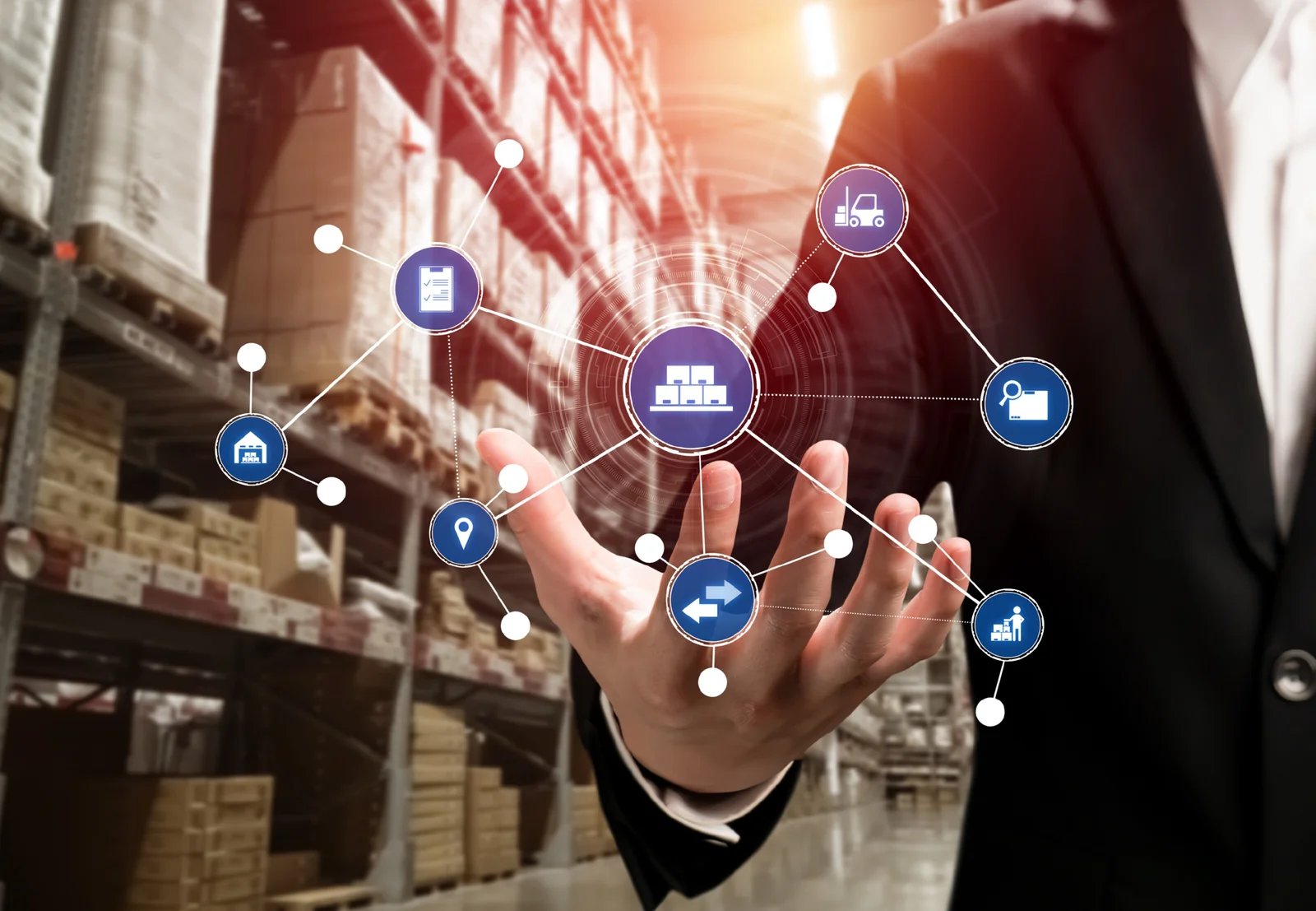 Businessman managing digital supply chain icons in a smart warehouse, demonstrating the efficiency benefits of Cannabis Supply Chain Software in inventory management.