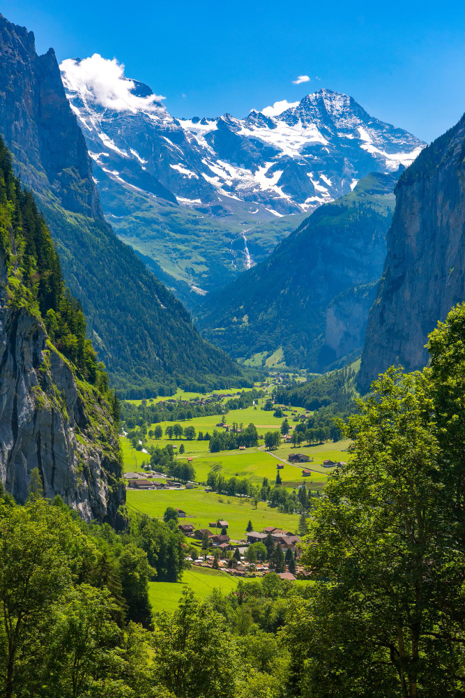 Picturesque Swiss mountain valley showing the beautiful landscape where cultivators can get a cannabis license in Switzerland through pilot programs