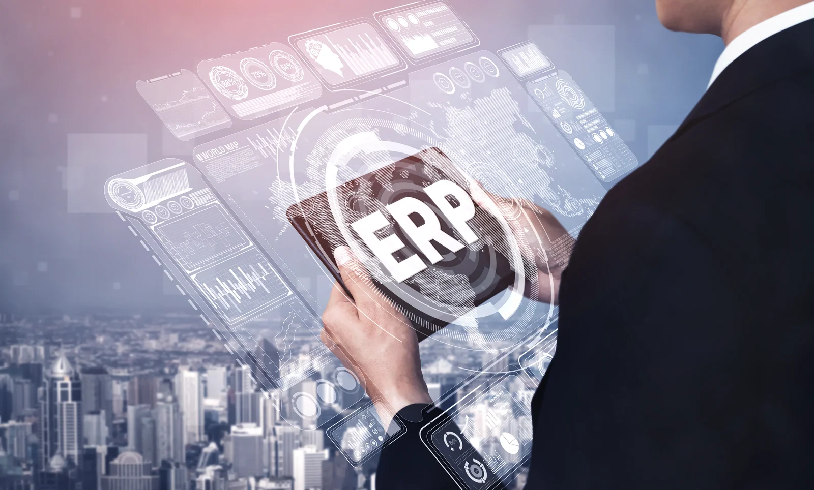 Business professional using a tablet with digital graphics representing ERP modernization and enterprise resource planning technology.